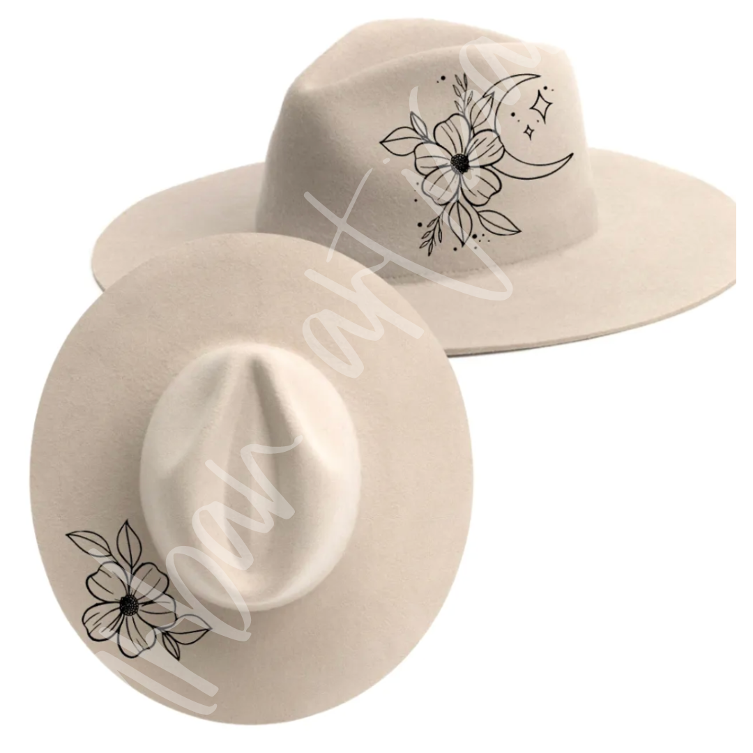 A hat with a flower and a crescent moon on it