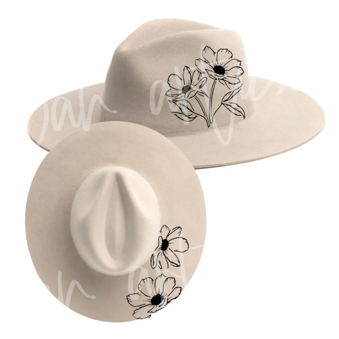 A white hat with black flowers on it
