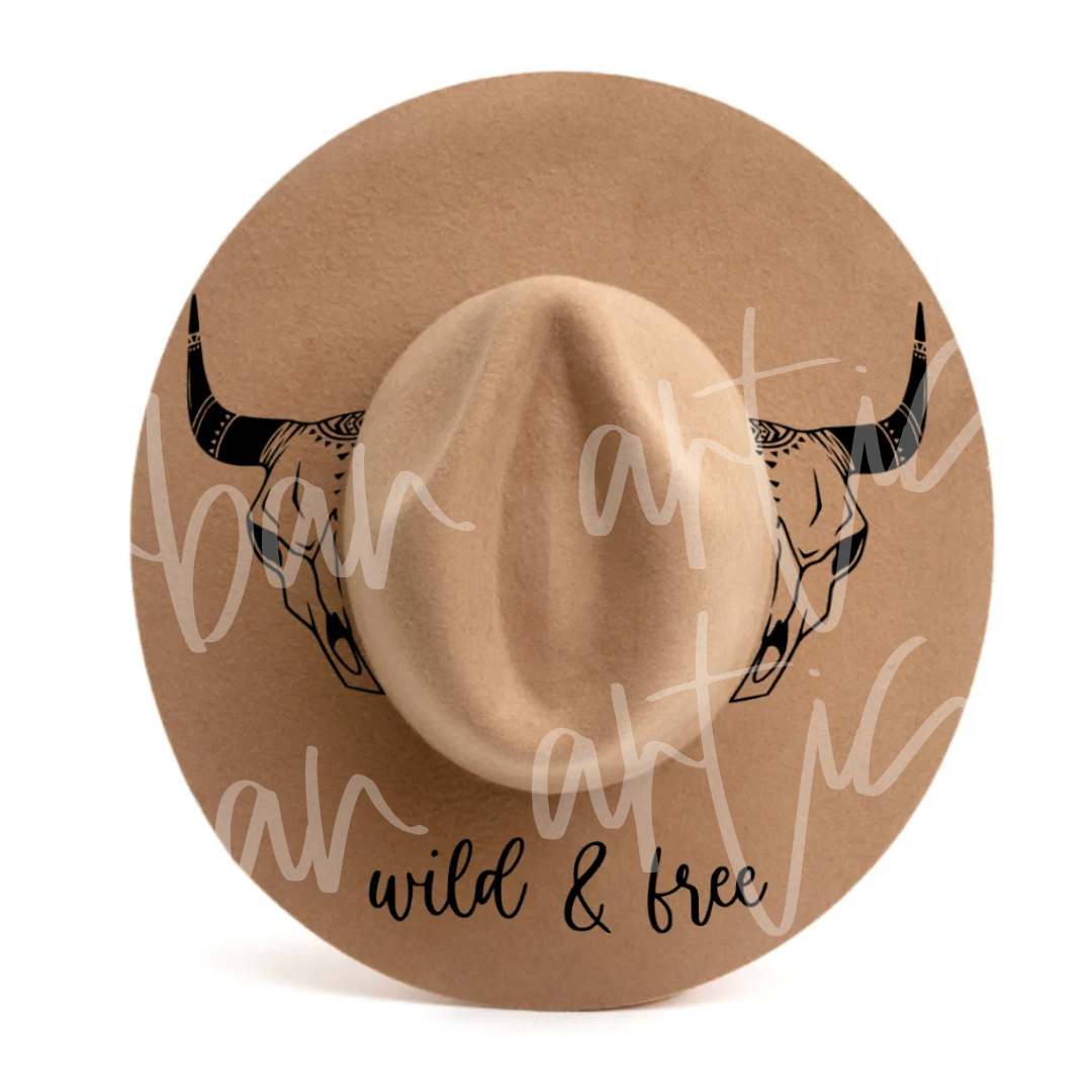 A hat with a bull skull and the words wild & free on it