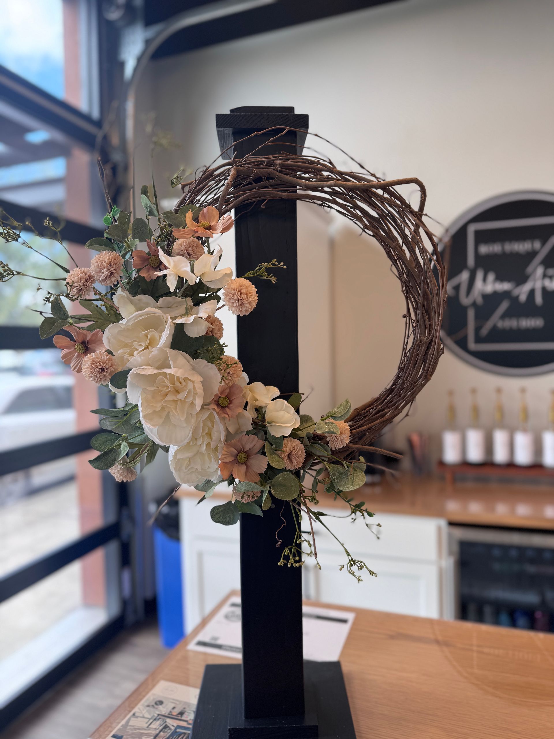 A wreath of paper flowers on a white background