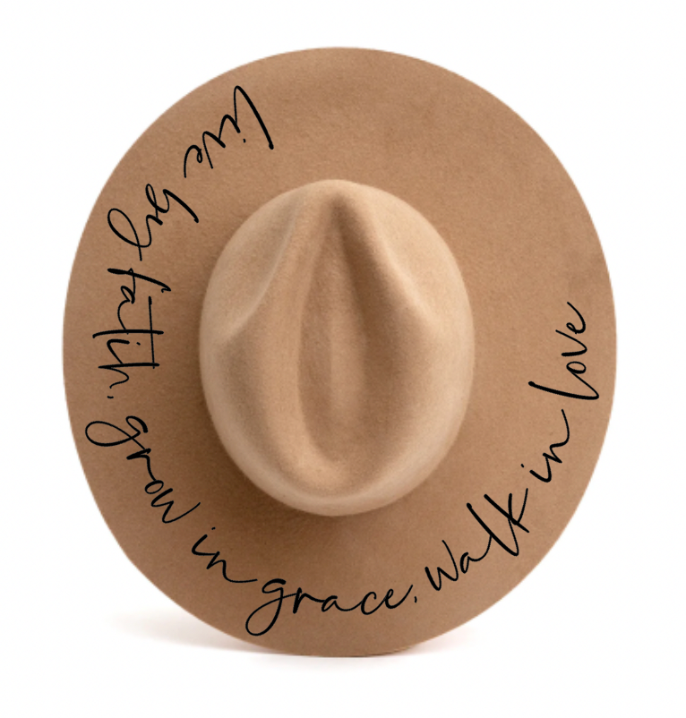 A hat that says live by faith grow in grace walk in love