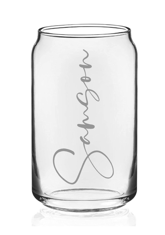 A clear glass can with the name samson etched on it.