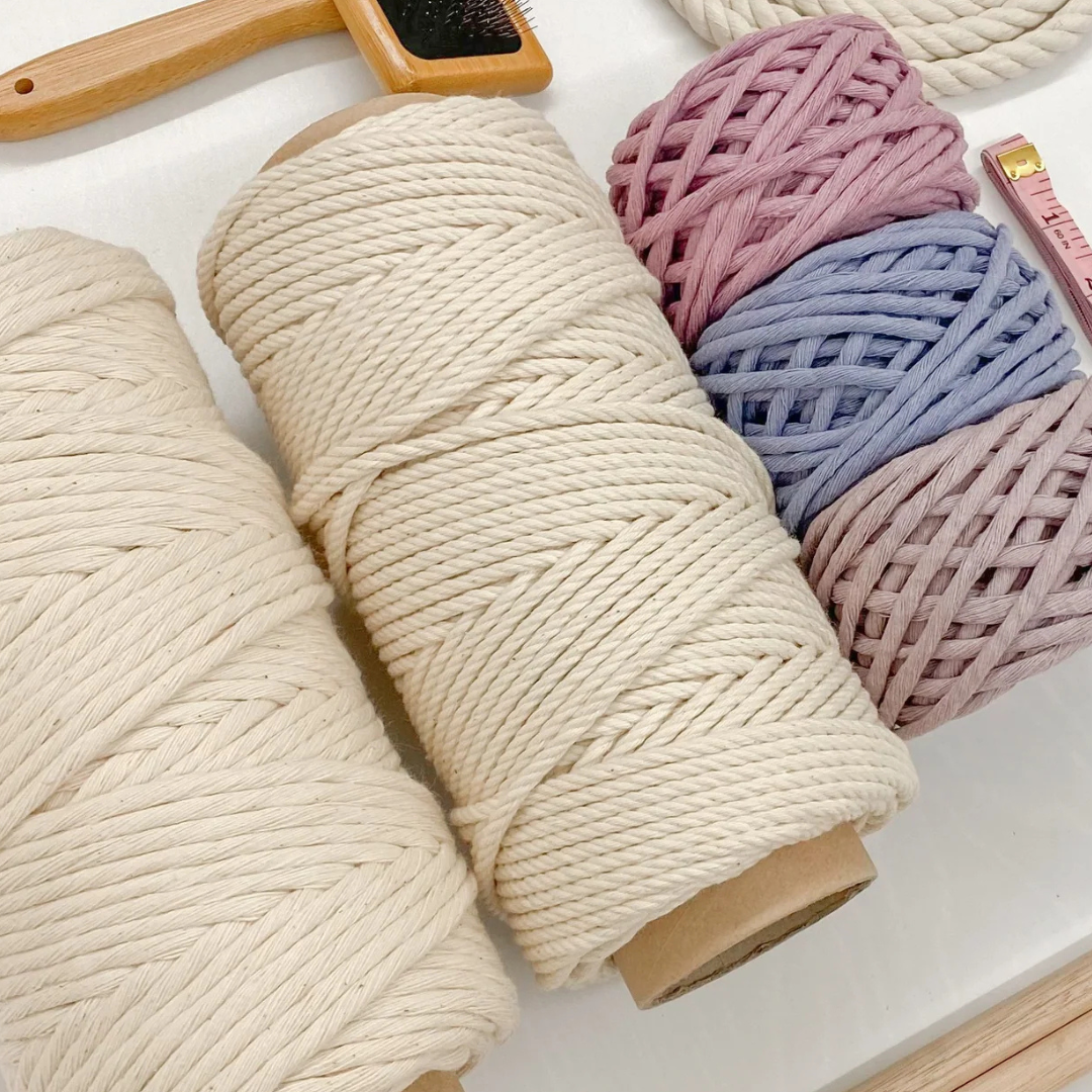 A bunch of spools of yarn are sitting on a table