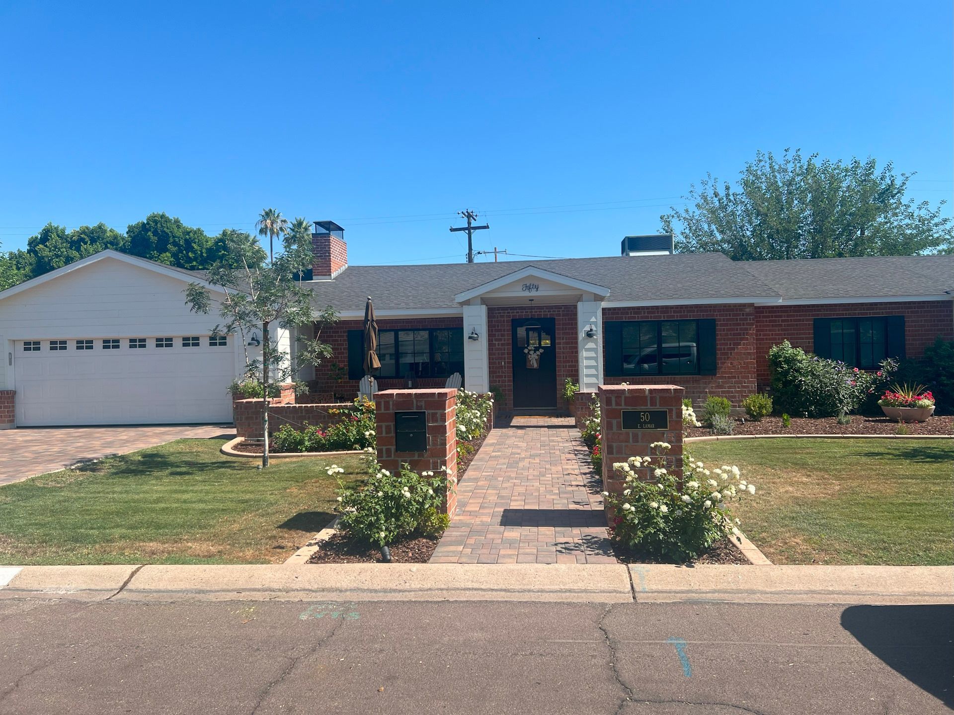 A large brick house with a white garage door