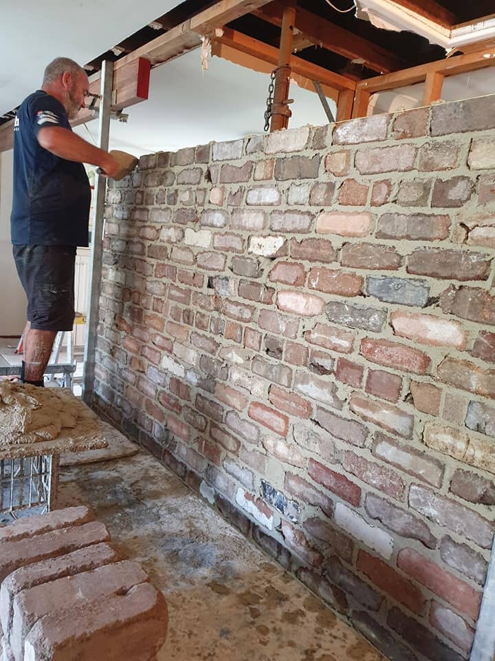 Man Fixing The Brick Wall — Bricklayers In St Georges Basin, NSW