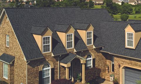 Pro Roofing — Black Shingle Roofs on Large House in Canton, MI