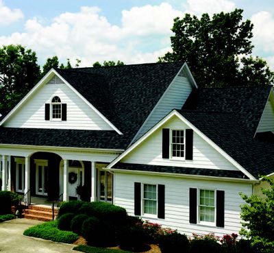Roofing Services — Luxury House With Black Roof in Canton, MI