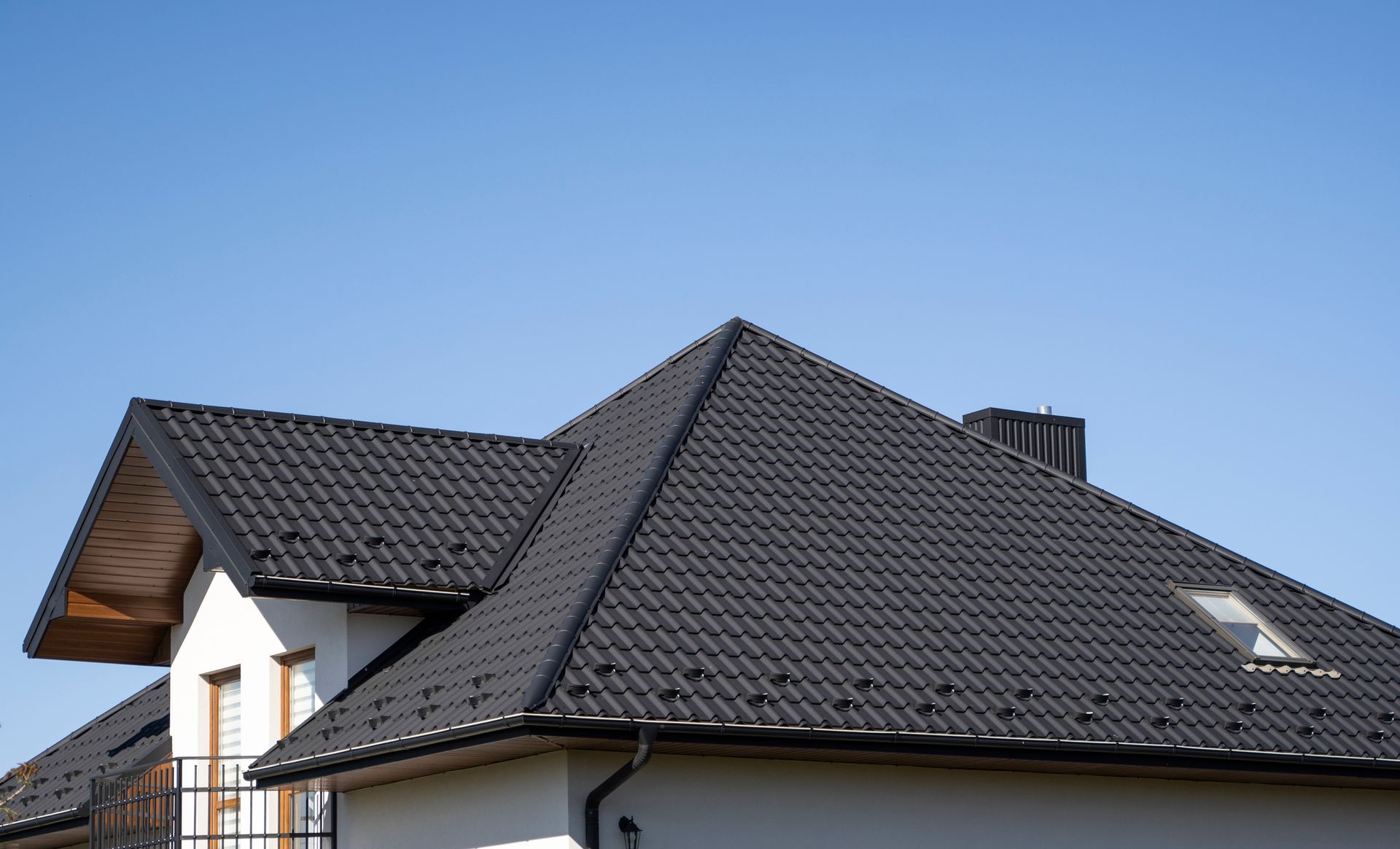 Corrugated metal roof, brown wavy profile, installed by reliable roofing contractors.