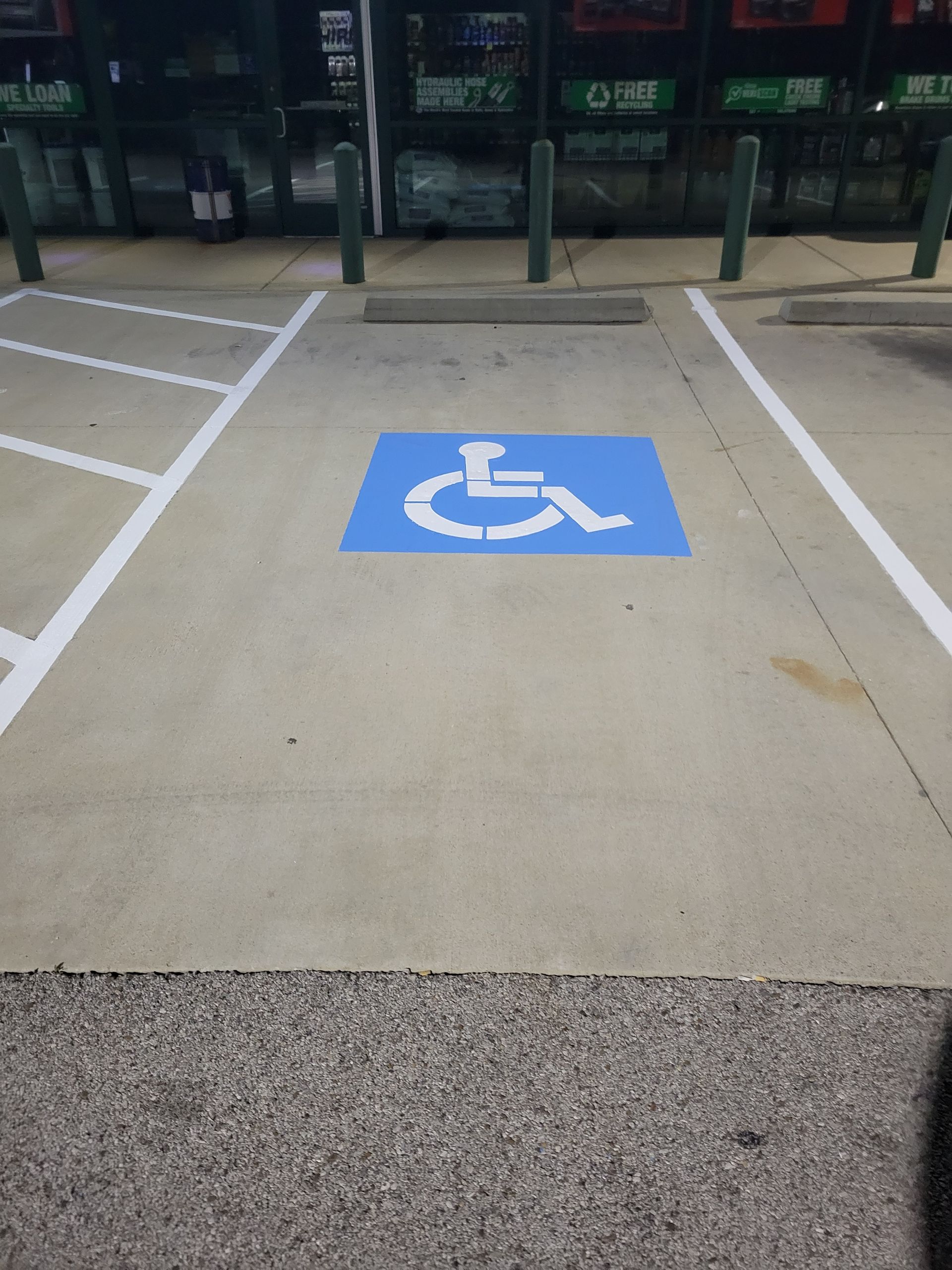 A handicapped parking spot in a parking lot