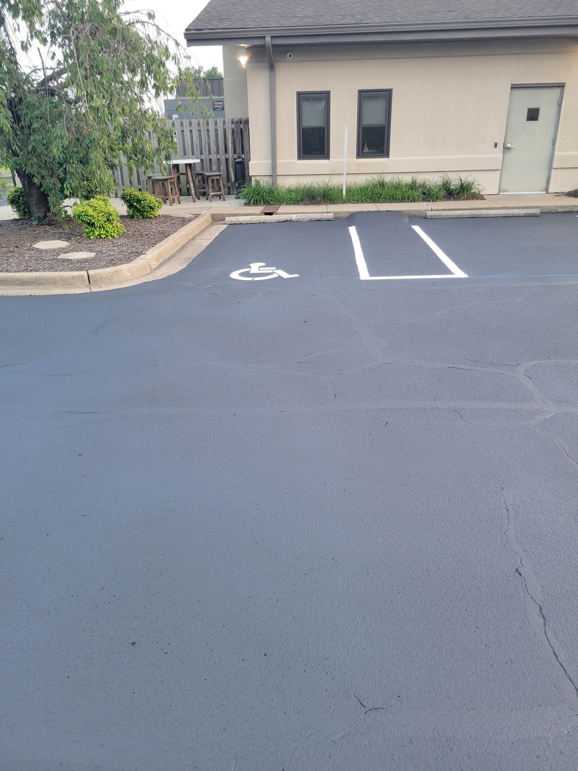 A handicapped parking spot in front of a building