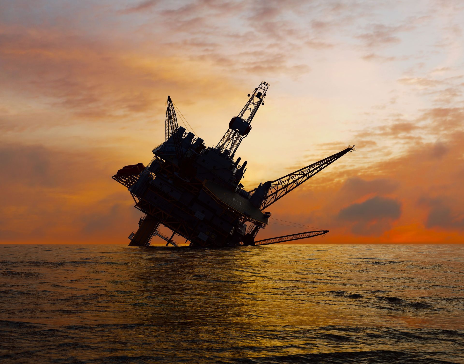 An oil rig in the middle of the ocean at sunset