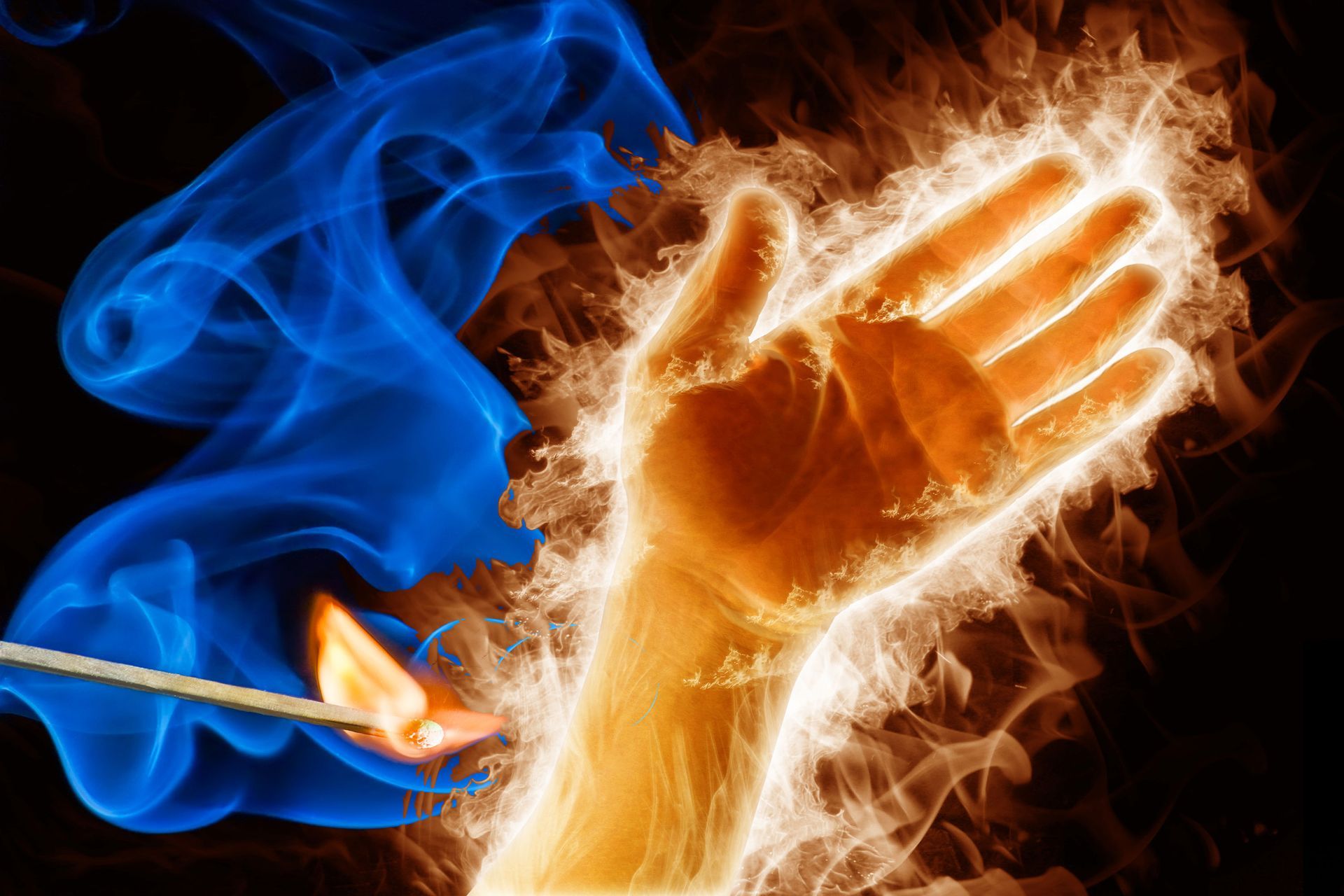 A hand in flames is being lit up by a match