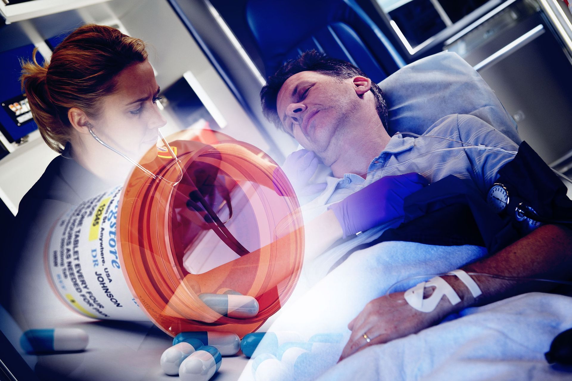 A man is laying in a hospital bed next to a bottle of pills