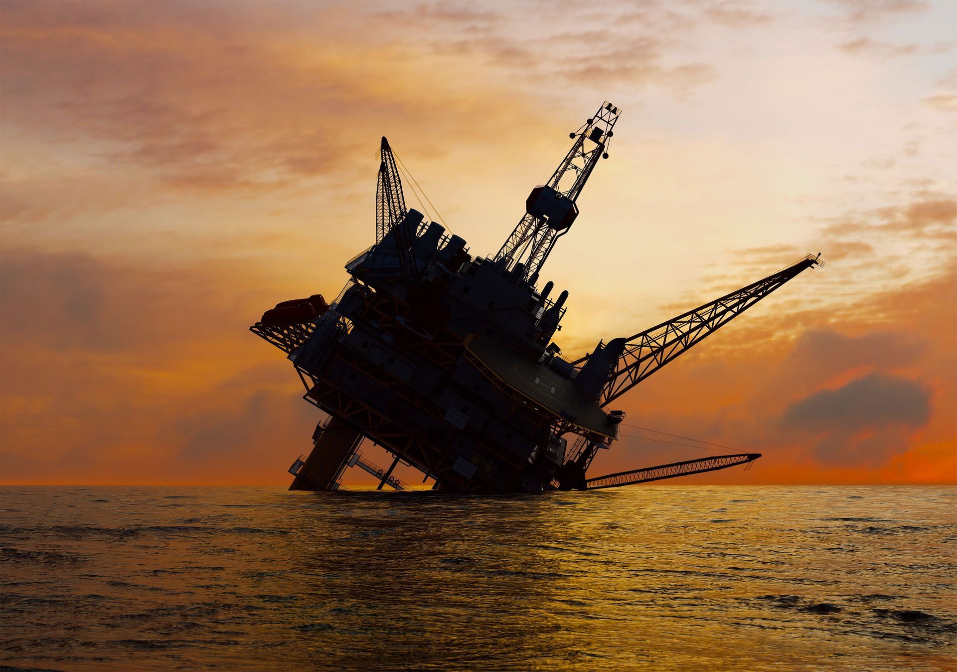 An oil rig tipped over in the middle of the ocean at sunset