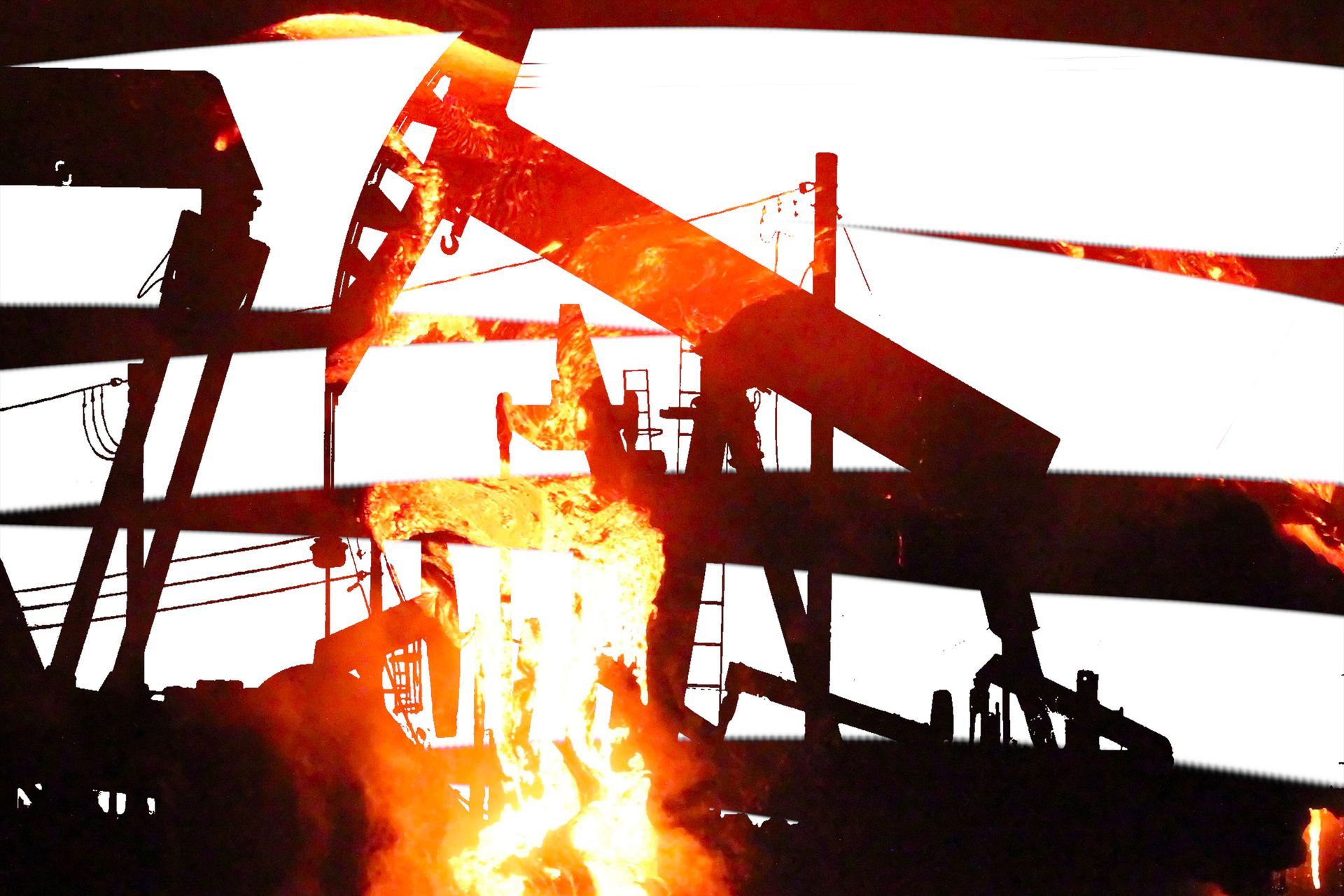 A silhouette of an oil rig on fire