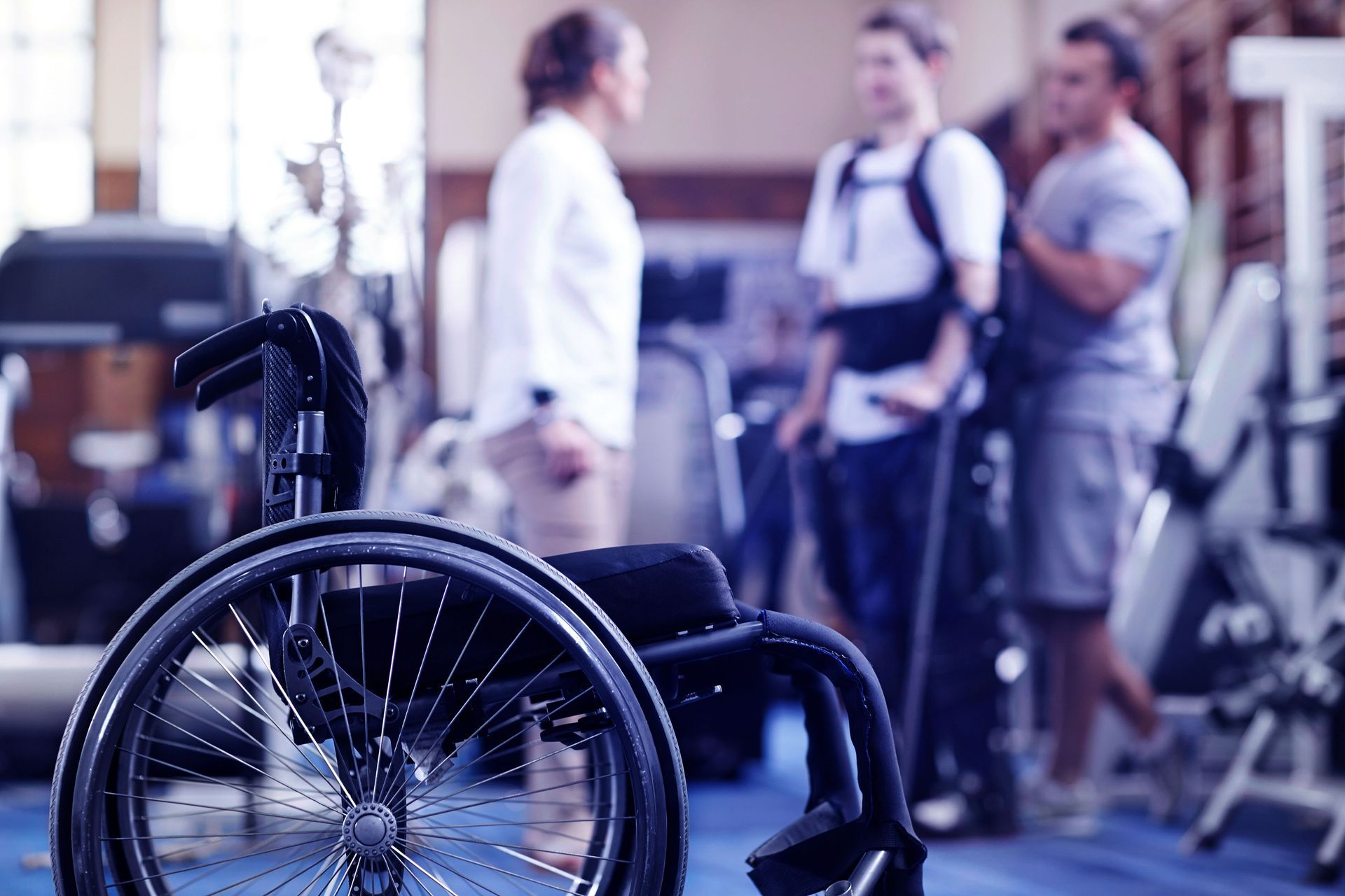 A person doing physical therapy exercises after a spinal cord injury