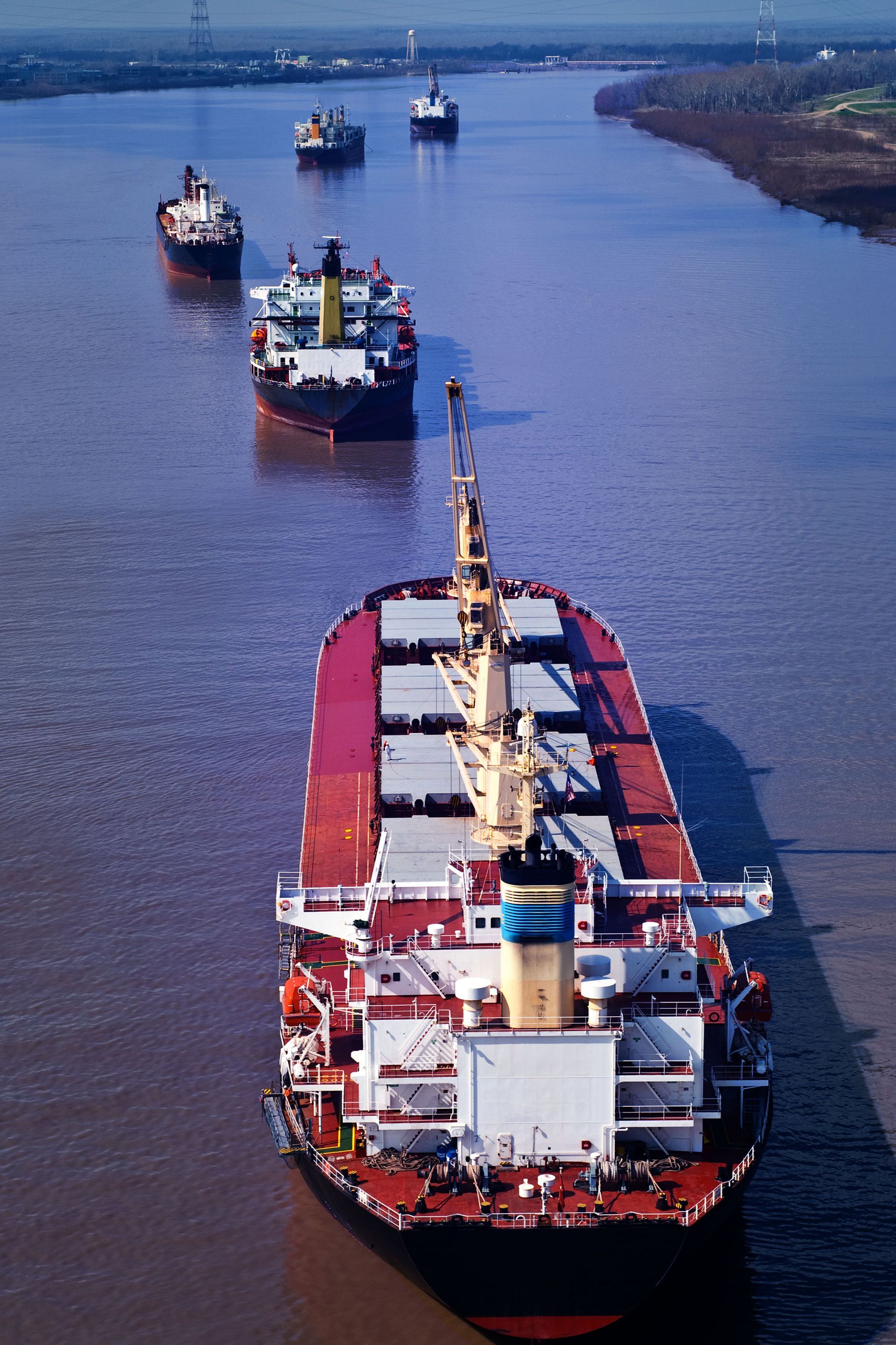 Several ships are floating on a large body of water