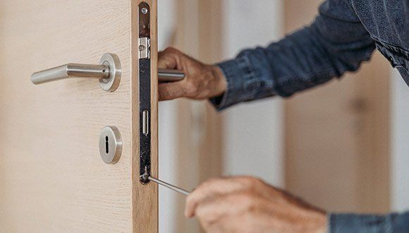 Locksmith Fixing Door Lock — Grants Pass, OR — Valley Lock & Key