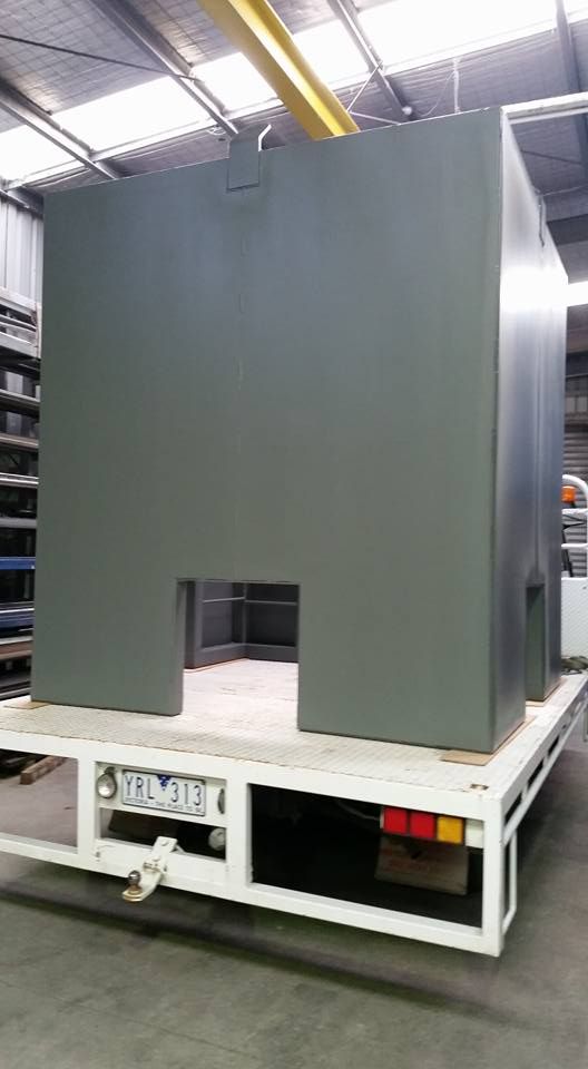 A Large, Gray Metal Structure With a Doorway Cutout — SPW Engineering & Powdercoating In Ballarat, VIC