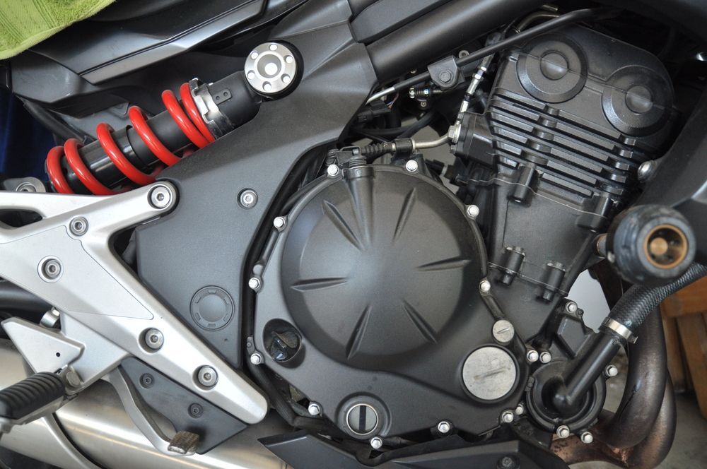Black Motorcycle Engine With Red Shock, and Silver Accents — SPW Engineering & Powdercoating In Ballarat, VIC