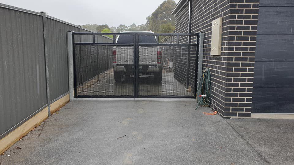 Ranger Truck Parked In A Driveway Behind A Gate — Engineering and Powdercoating in Ballarat, VIC