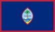 The flag of guam has a palm tree and a sailboat on it.