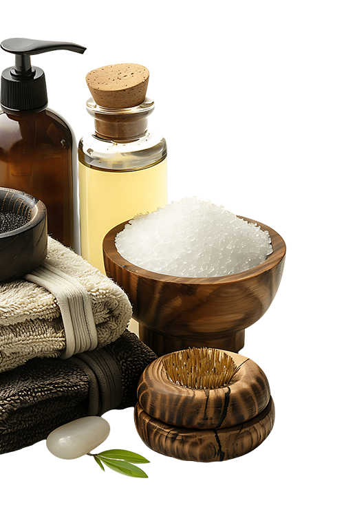Spa towels a bowl of salt a bottle of oil and a soap dispenser
