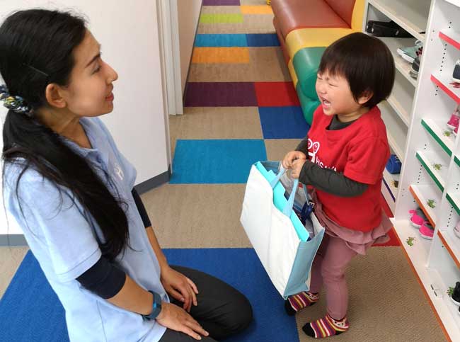 Preschool child crying as a says goodbye to his mother