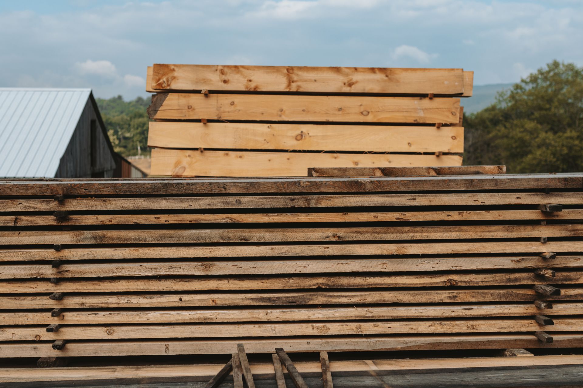 A stack of wooden boards sitting on top of each other.