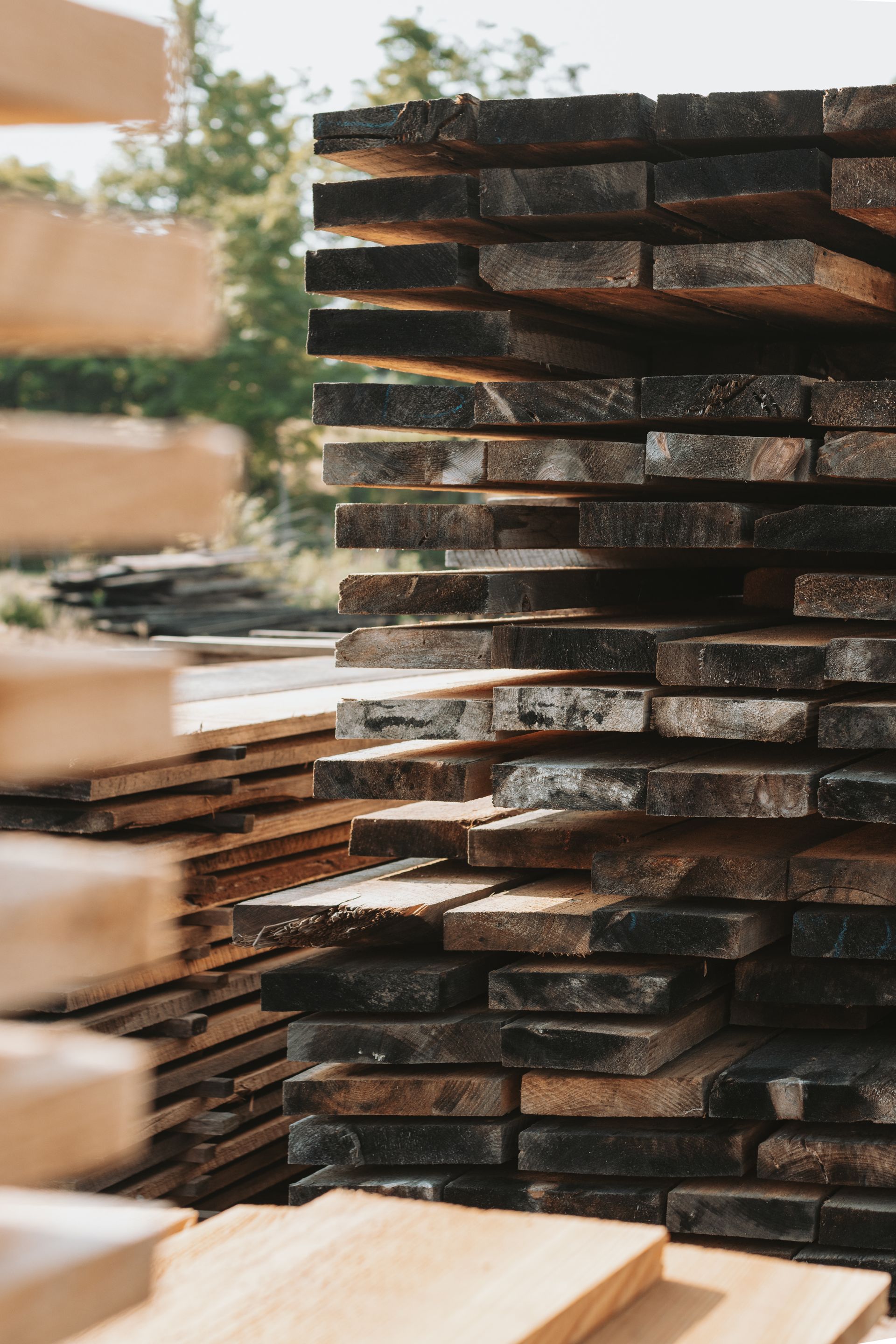 A pile of wooden boards stacked on top of each other.