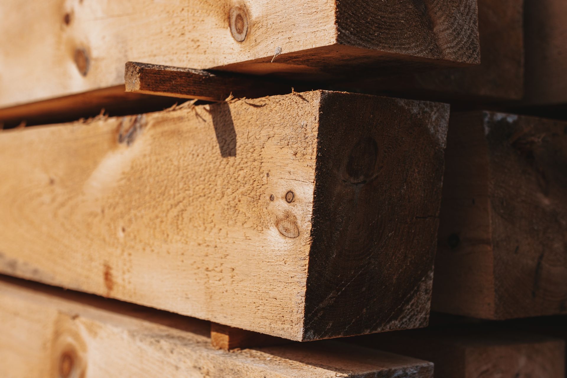 A close up of a pile of wooden blocks stacked on top of each other.