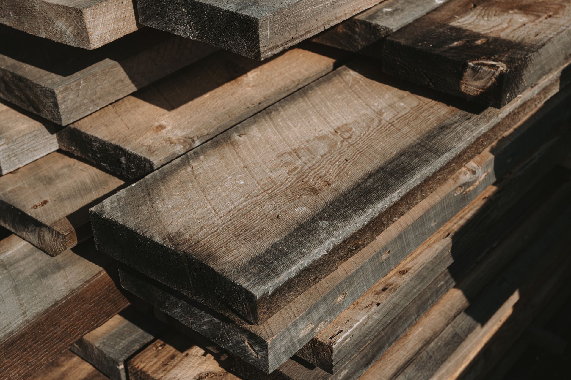 A pile of wood is stacked on top of each other