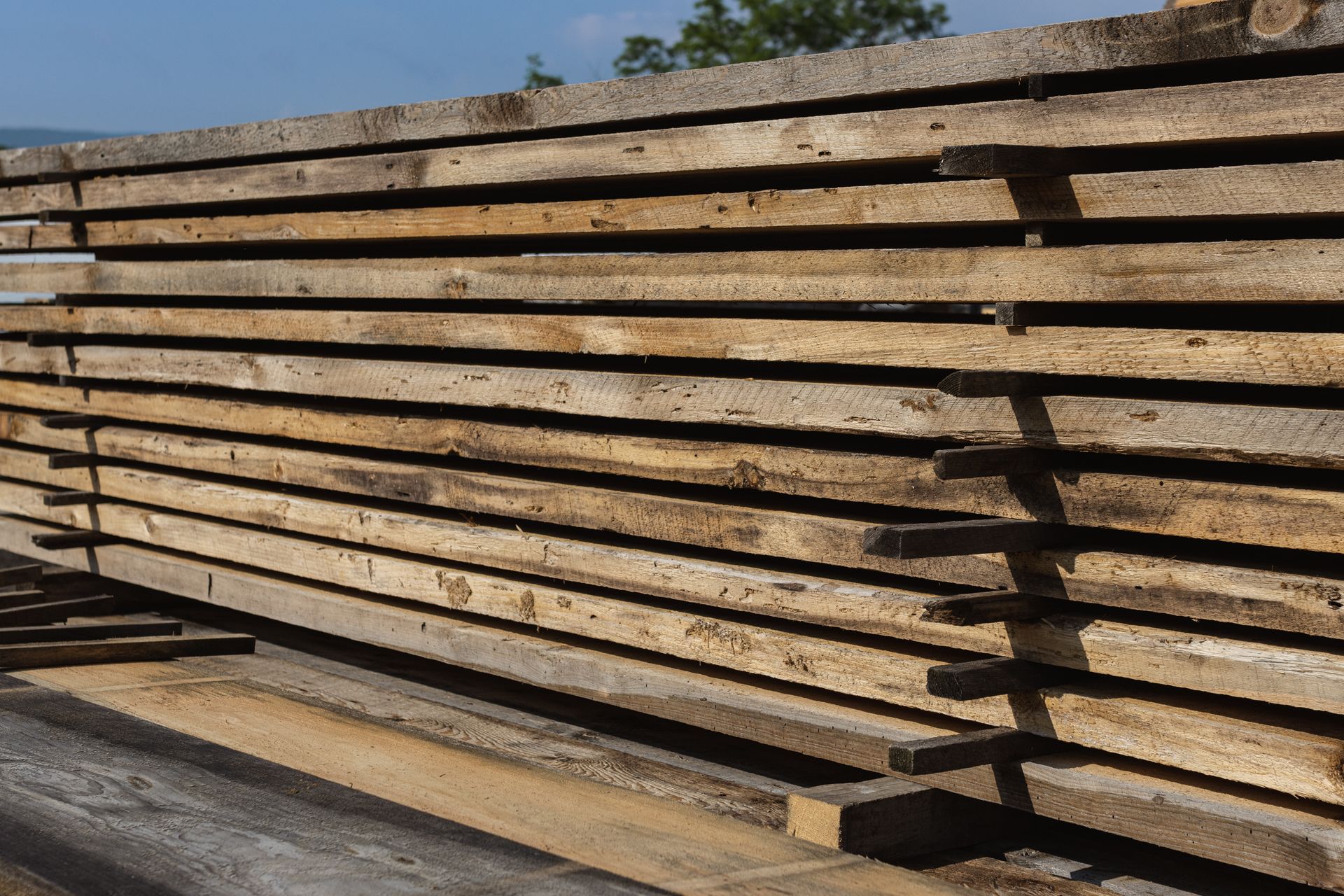 A stack of wooden boards sitting on top of each other