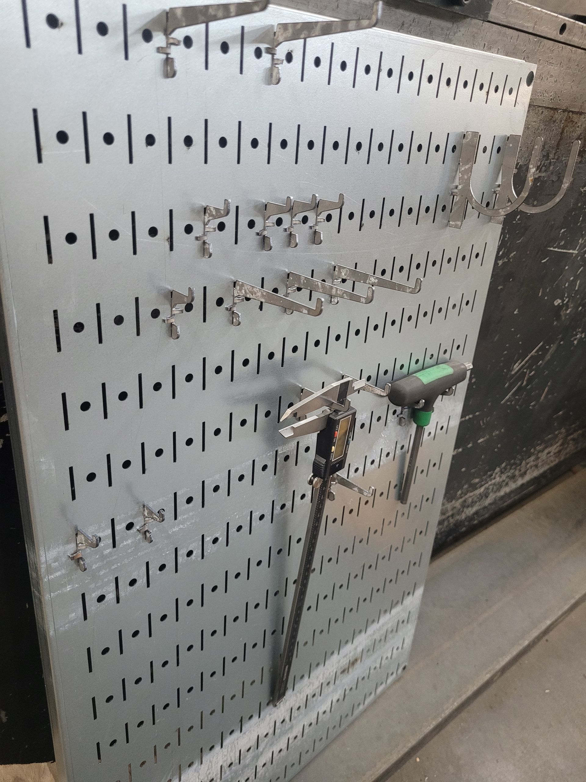 A metal board with a bunch of numbers on it