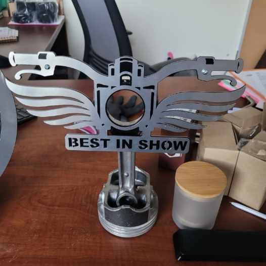 A trophy that says best in show on it