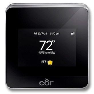A smart thermostat with a screen that shows the temperature and humidity.