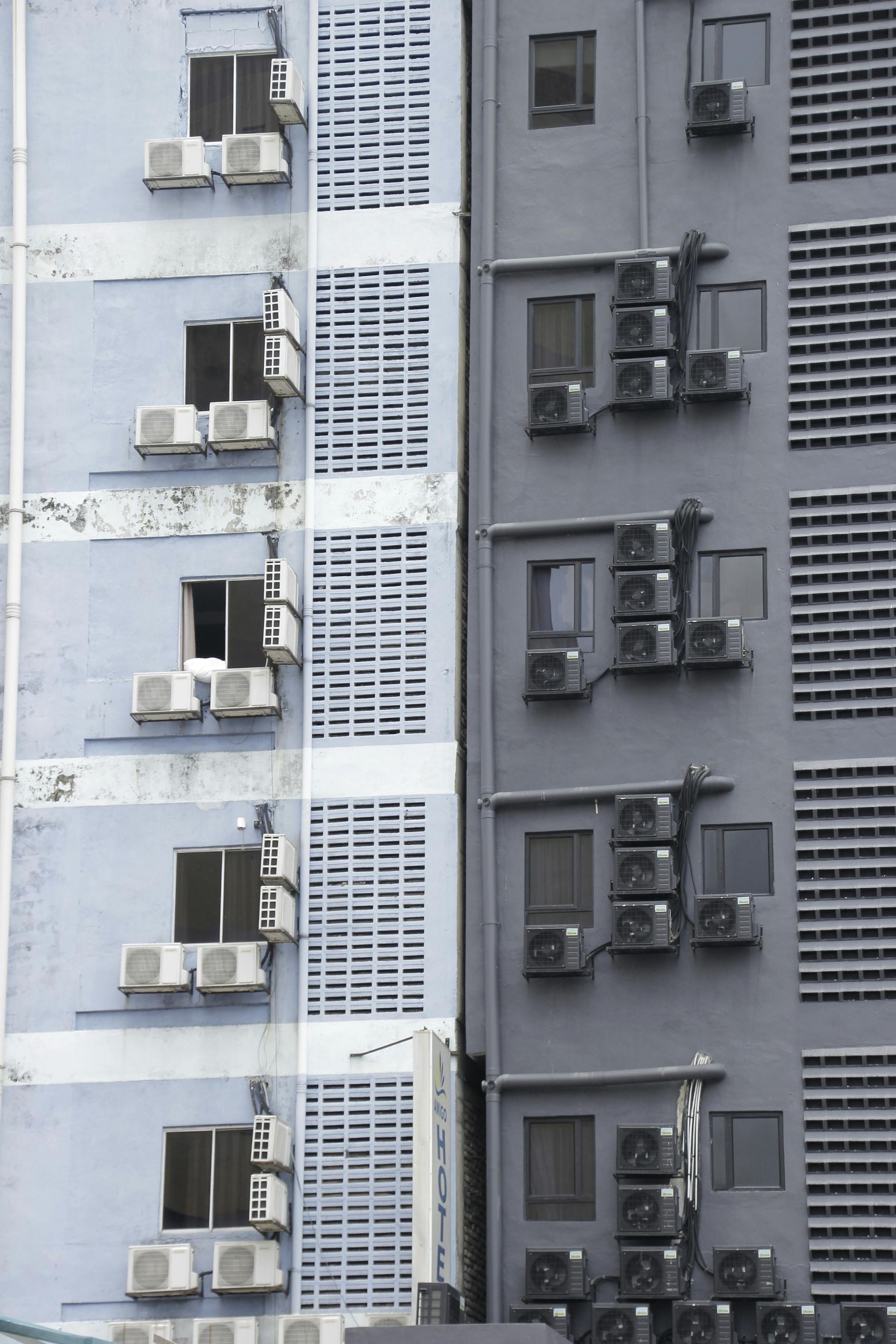 A building with a lot of air conditioners on it