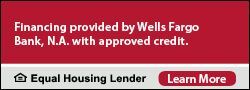 A red sign that says financing provided by wells fargo bank n.a. with approved credit equal housing lender learn more