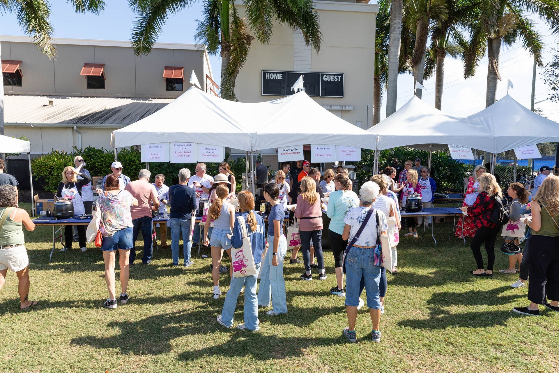palm beach county food bank empty bowls fundraising event crowd enjoying soup and art 