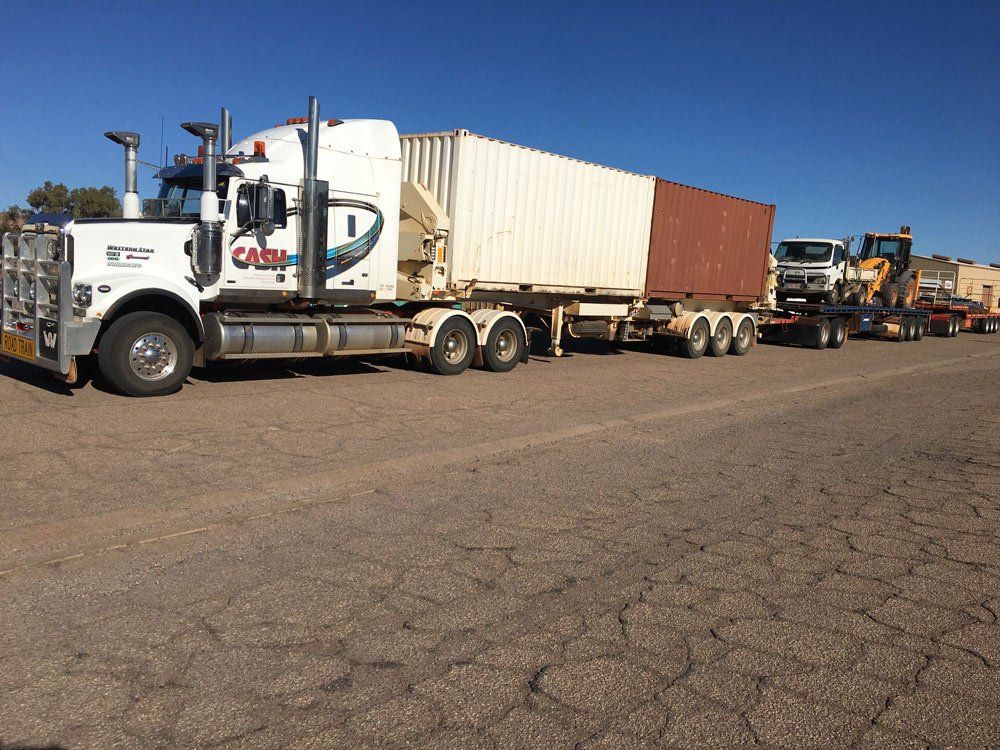 Road Train Truck Carrying Two Container And Equipment — Central Australian Sidelifter Haulage In Braitling NT