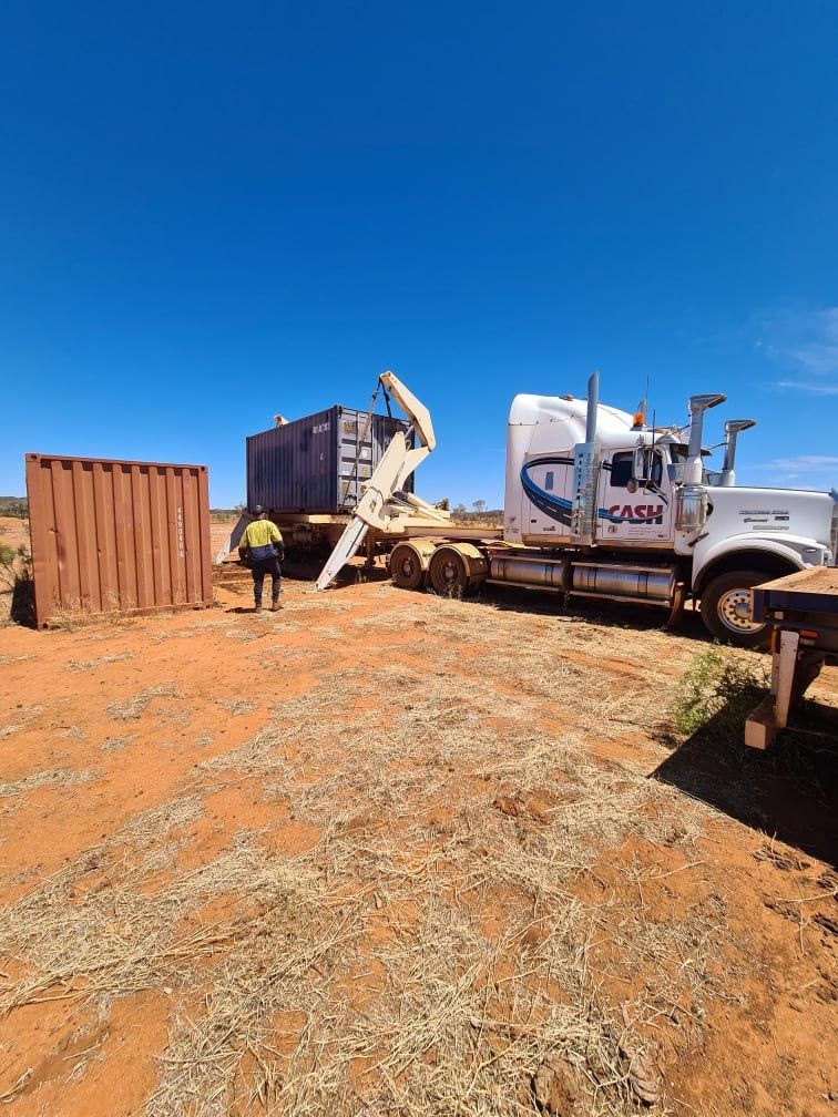 Loading the Container On The Truck — Central Australian Sidelifter Haulage In Braitling NT