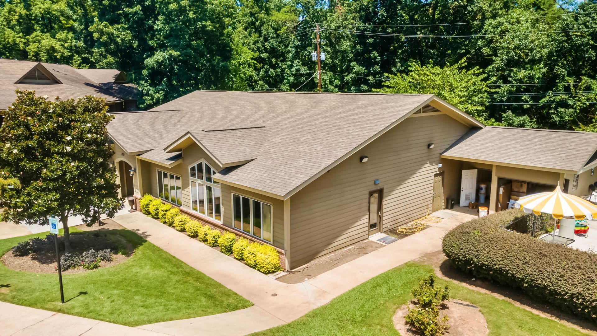 An aerial view of a large house with a lot of windows