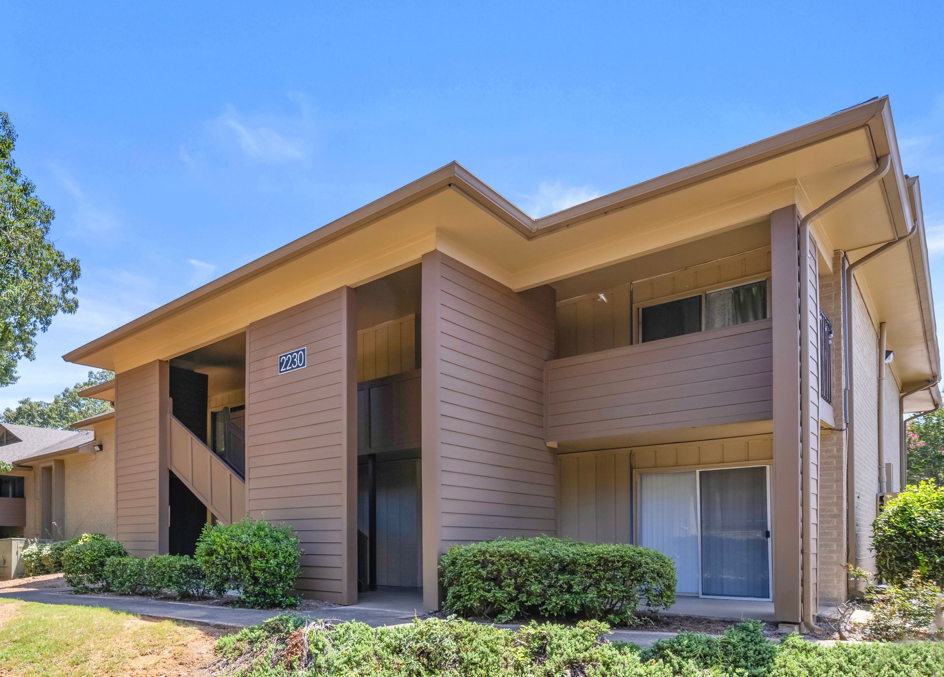 A large apartment building with the number six on it