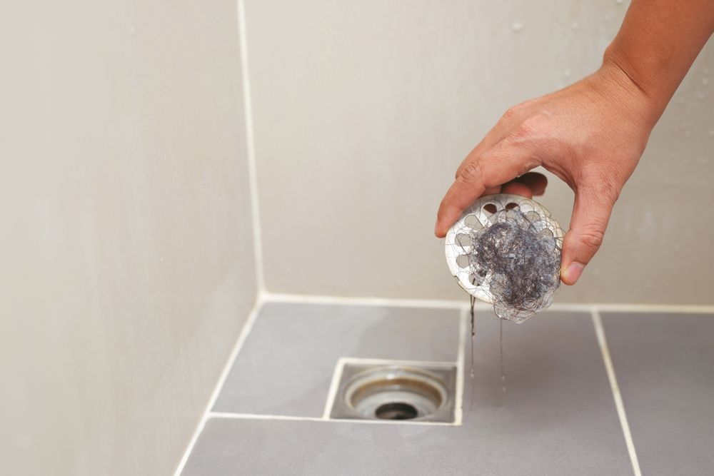 A bathroom faucet with water running out of it