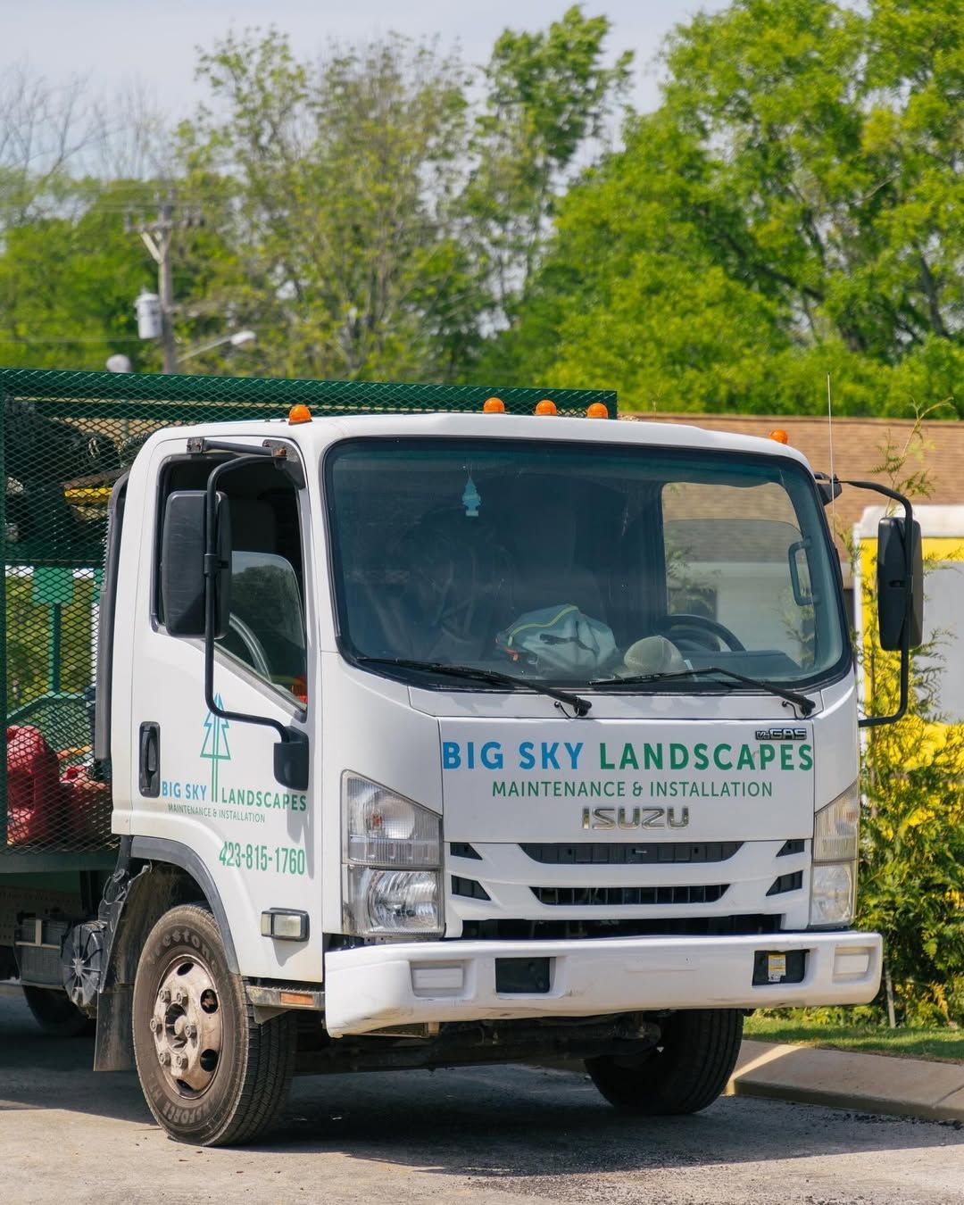 White Isuzu landscape truck, 