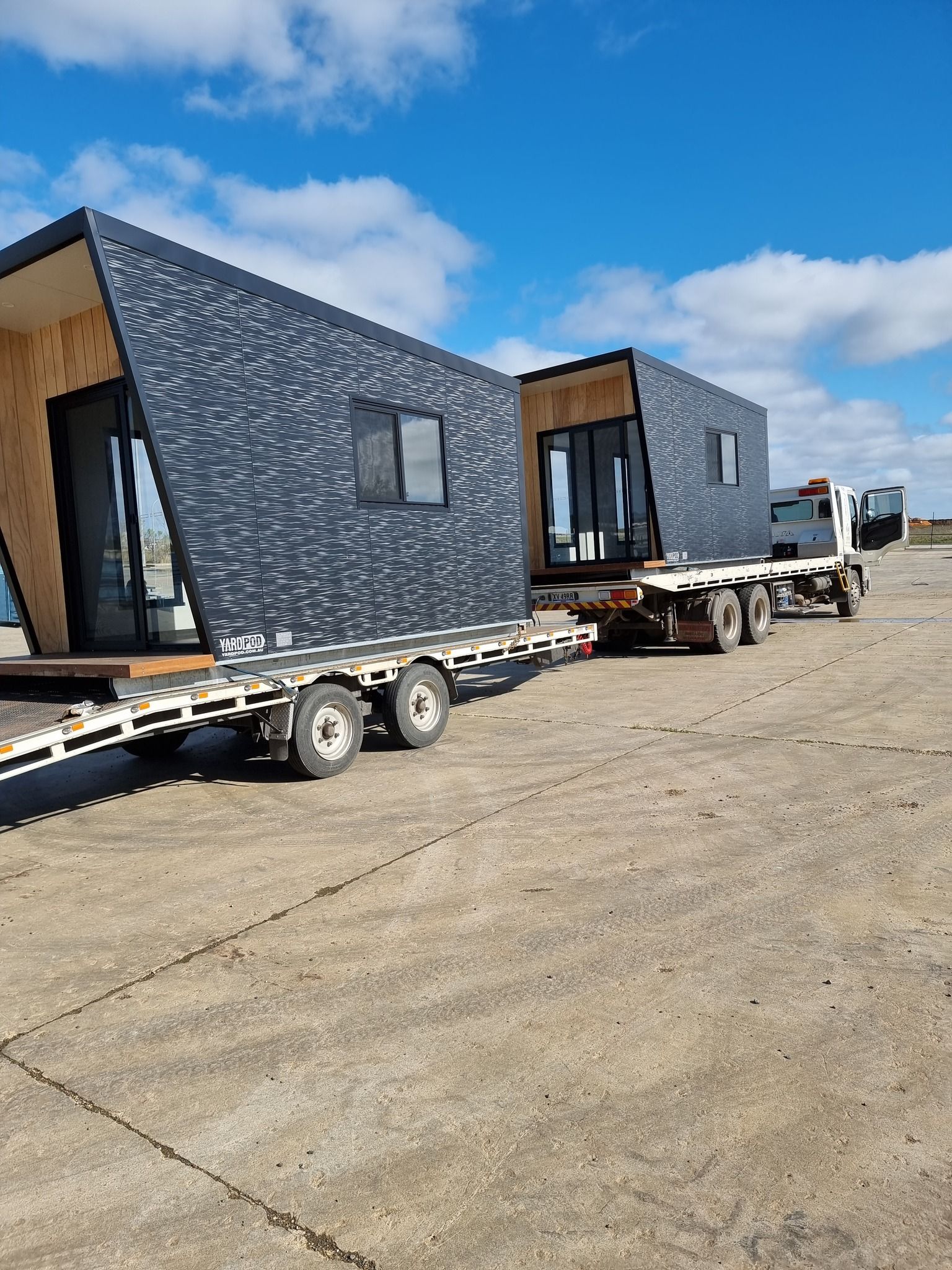 A Semi Truck With a Trailer Attached to It is Parked on the Side of the Road — Ballarat Supatilt in Bendigo, VIC