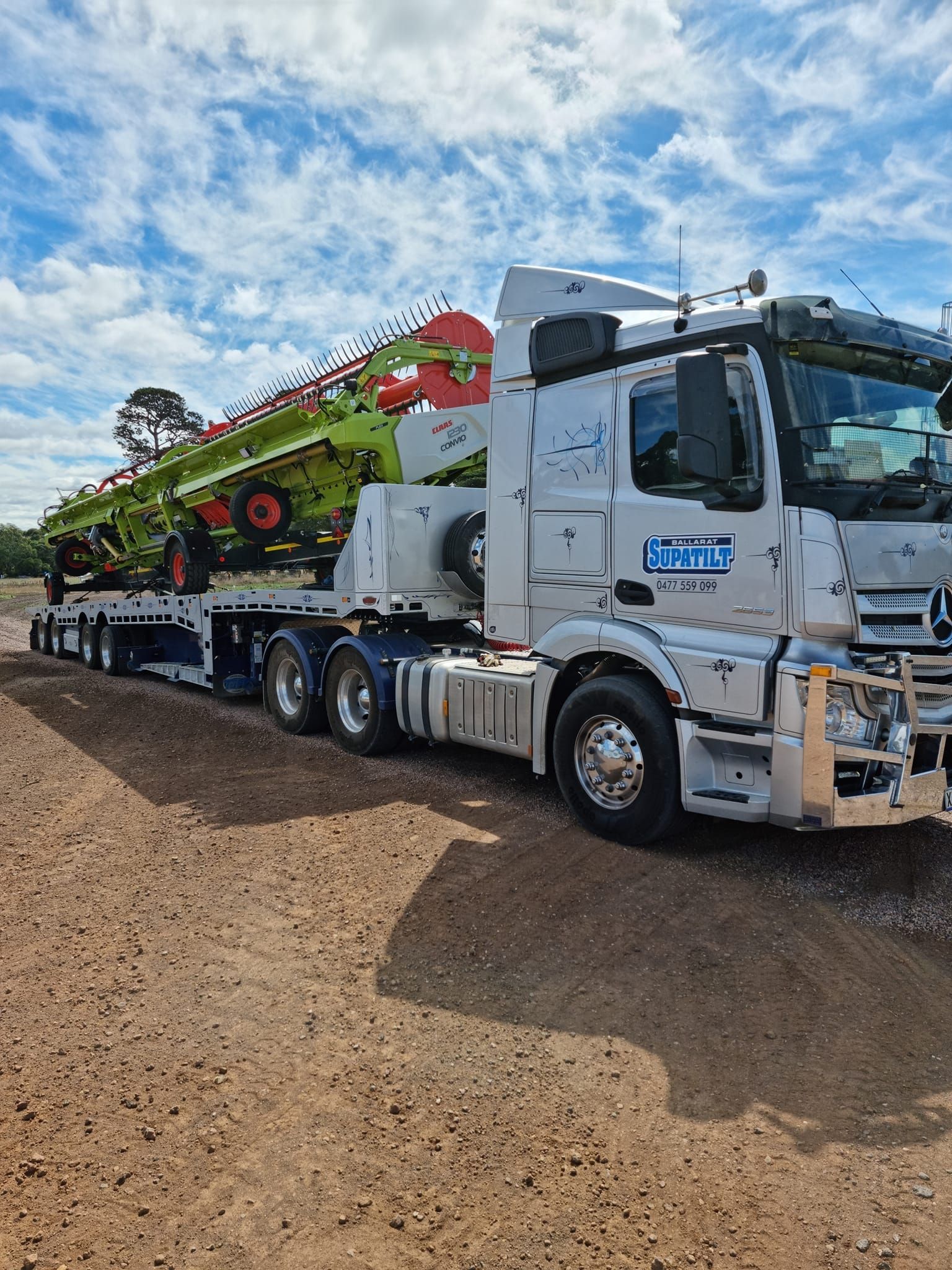 Truck Transporting Large Red Vehicle — Ballarat Supatilt in Delacombe, VIC