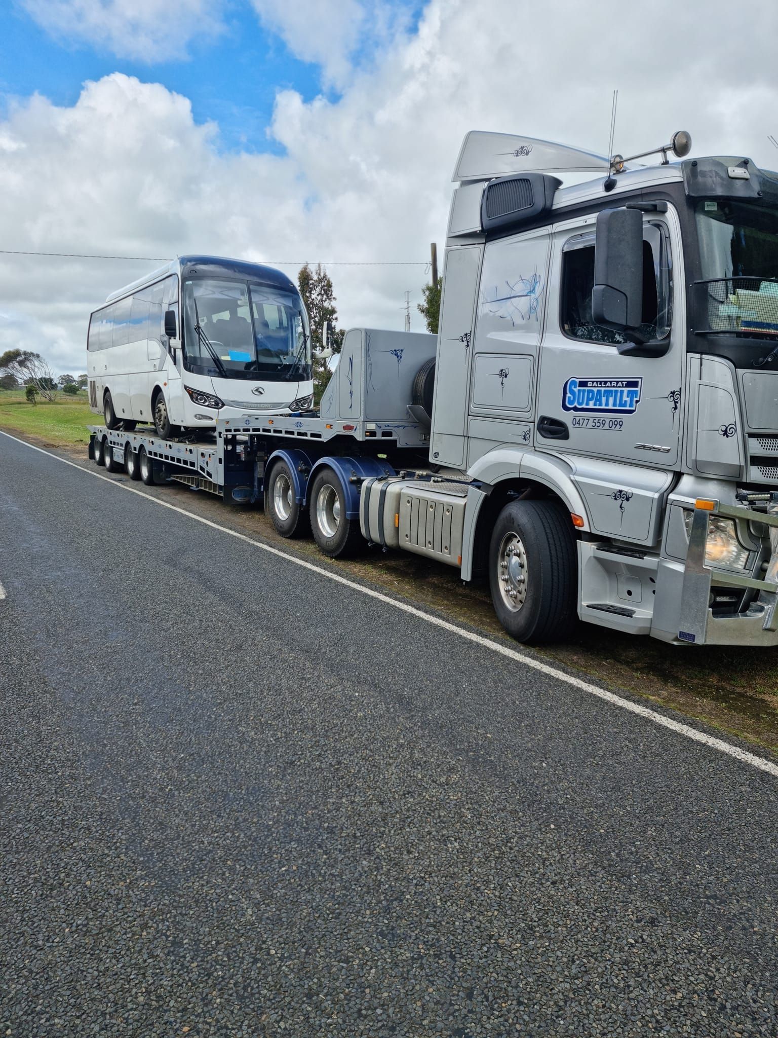 A Red Car is Being Towed by a Tow Truck — Ballarat Supatilt in Ballarat, VIC