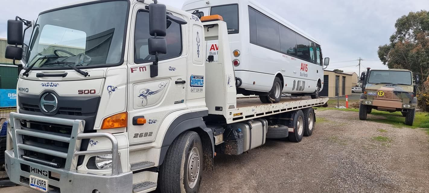 A Red Car is Being Towed by a Tow Truck — Ballarat Supatilt in Bendigo, VIC