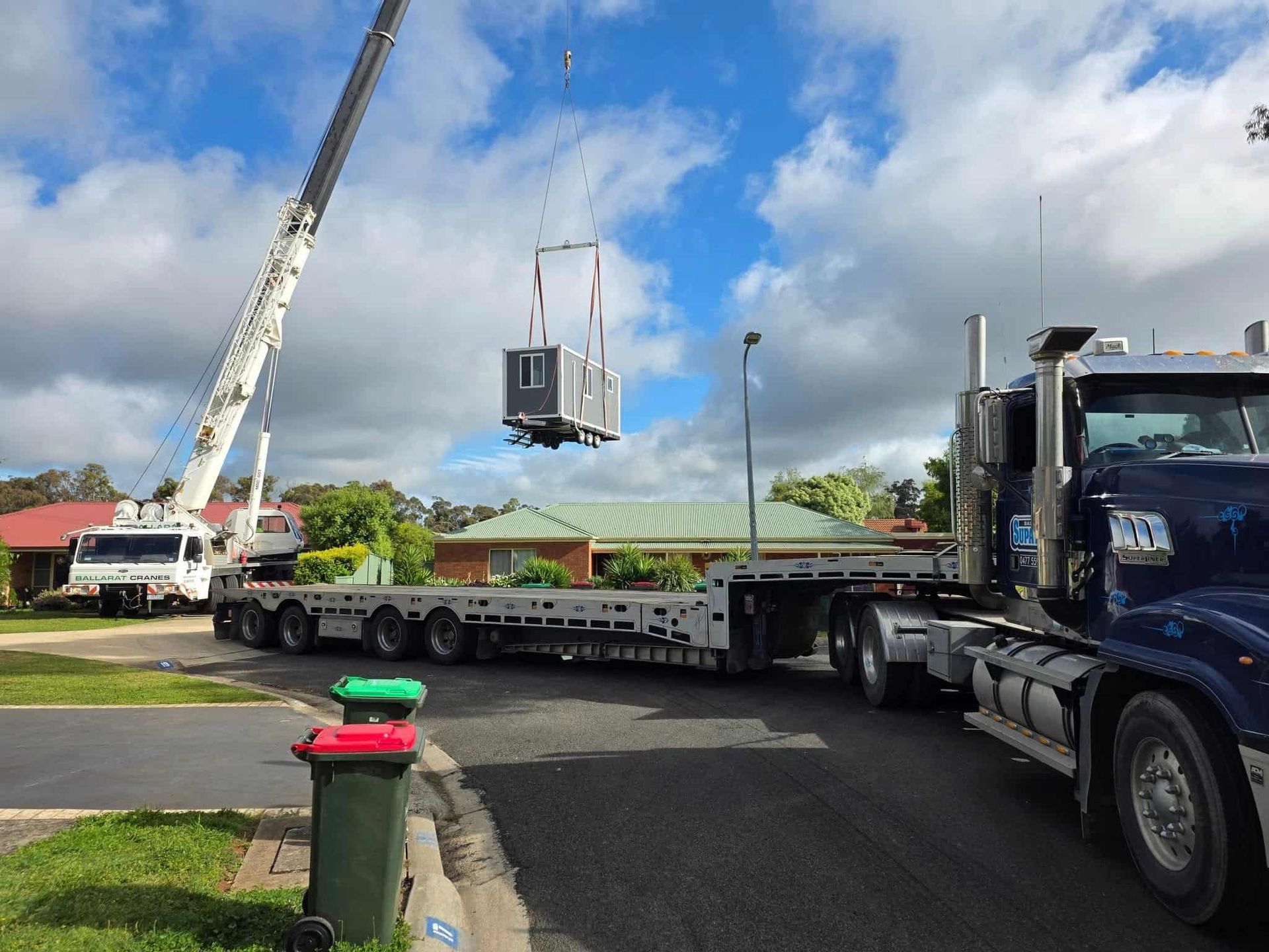 Crane Lifting a Small Structure Onto a Flatbed Truck — Ballarat Supatilt in Delacombe, VIC
